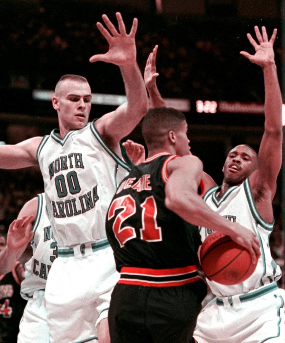 Virginia’s Harold Deane is surrounded by North Carolina’s Eric Montross (left) and Harold Deane during the ACC tournament championship game on Sunday. The Tar Heels beat the Cavs 73-66 and earned a No.1 seed in the NCAA tournament. Christopher Record/File photo