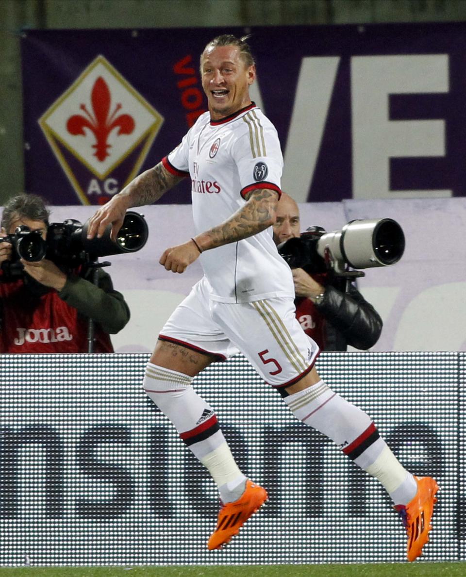 Milan's Philippe Mexes celebrates after scoring during a Serie A soccer match between Fiorentina and Milan at the Artemio Franchi stadium in Florence, Italy, Wednesday, March 26, 2014. (AP Photo/Fabrizio Giovannozzi)