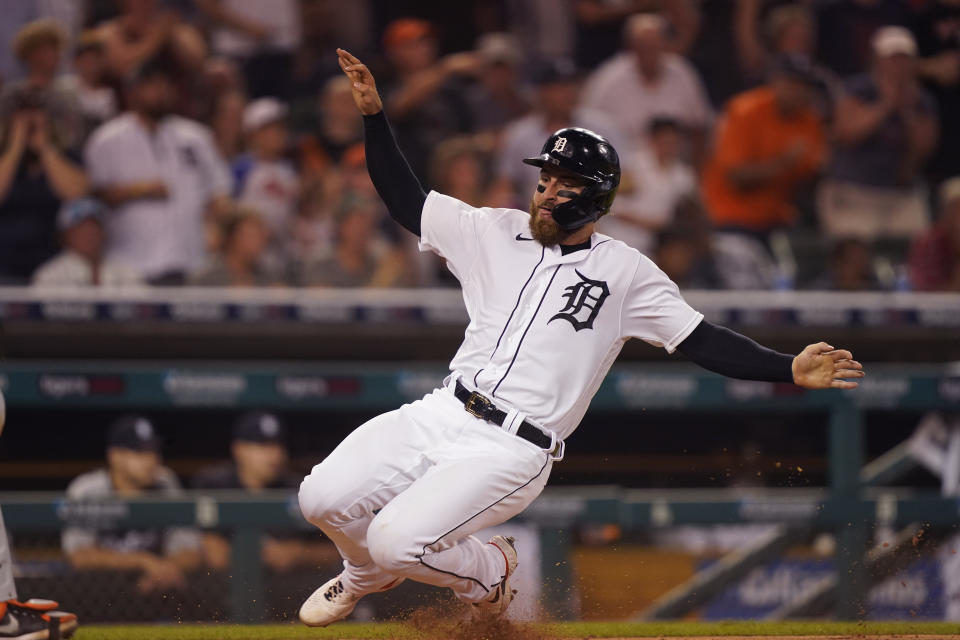 Detroit Tigers' Eric Haase slides home to score from first on a triple by teammate Jeimer Candelario during the seventh inning of a baseball game against the Baltimore Orioles, Thursday, July 29, 2021, in Detroit. (AP Photo/Carlos Osorio)