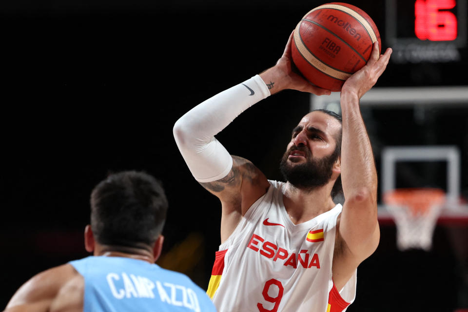 Spain's Ricky Rubio (R) shoots the ball as Argentina's Facundo Campazzo watches in the men's preliminary round group C basketball match between Spain and Argentina during the Tokyo 2020 Olympic Games at the Saitama Super Arena in Saitama on July 29, 2021. (Photo by Thomas COEX / AFP) (Photo by THOMAS COEX/AFP via Getty Images)