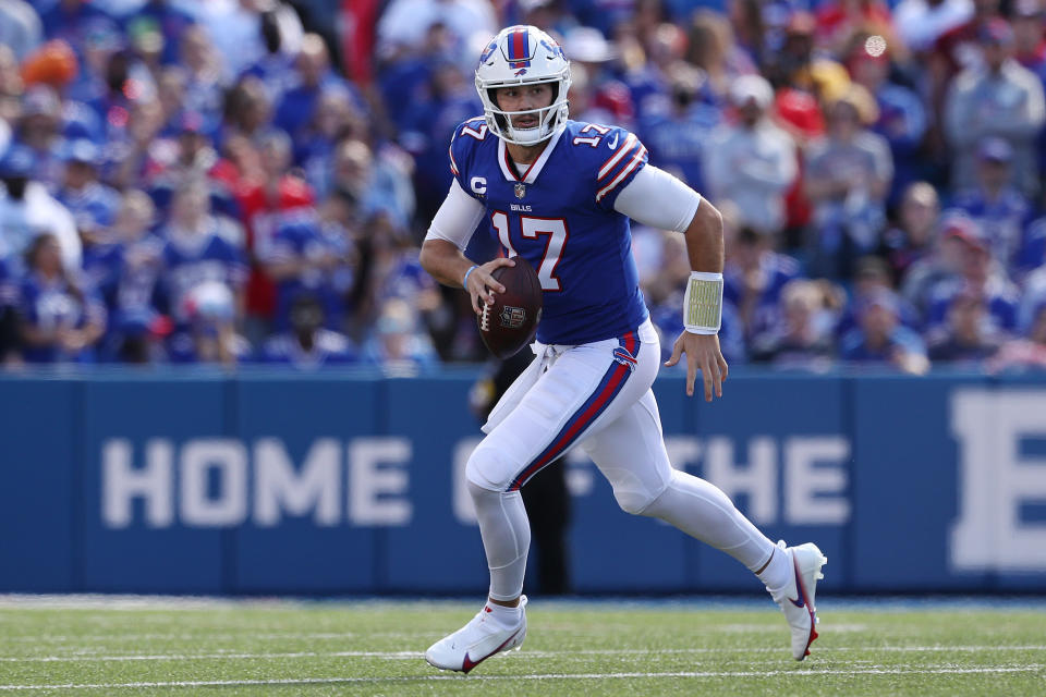 ORCHARD PARK, NEW YORK - SEPTEMBER 26: Quarterback Josh Allen #17 of the Buffalo Bills runs to his right with the ball in the first quarter of the game against the Washington Football Team at Highmark Stadium on September 26, 2021 in Orchard Park, New York. (Photo by Bryan M. Bennett/Getty Images)