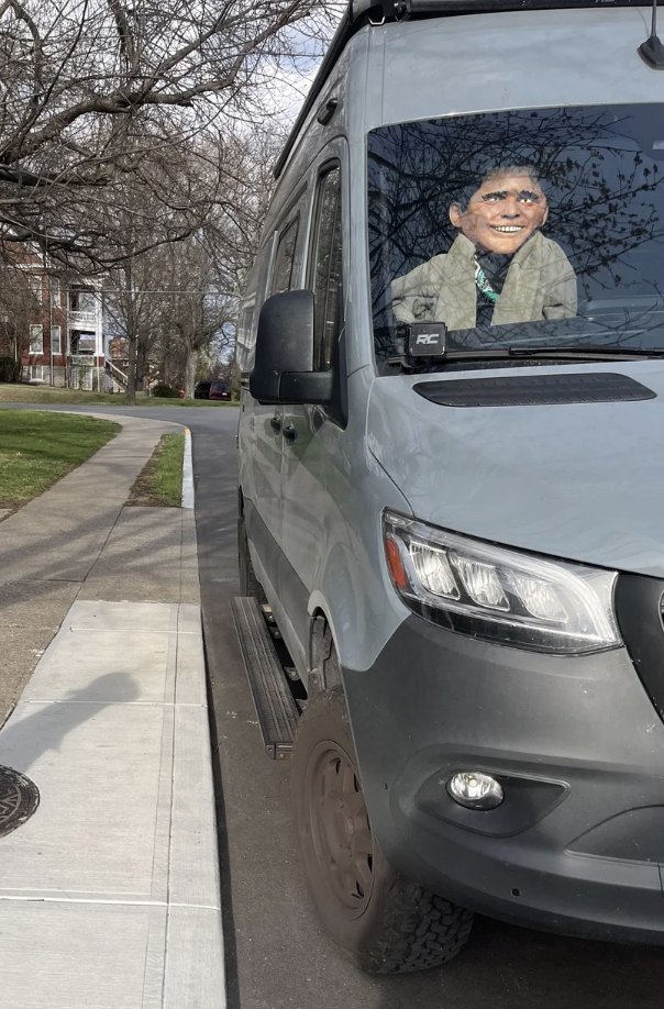 a mannequin in a parked van