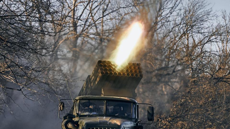 A Ukrainian Grad multiple rocket launcher fires at Russian positions near Bakhmut in the Donetsk region of Ukraine on Dec. 5, 2022. (Libkos/AP)