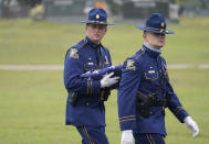 Members of a Louisiana State Police honor guard conclude their practice of folding an American flag to be presented to the family of Master Trooper Chris Hollingsworth during burial services, Friday, Sept. 25, 2020 in West Monroe, La. Hollingsworth, killed in a car crash hours after he was told he would be fired for his role in the death of a Black man, was buried with honors Friday at a ceremony that authorities sought to keep secret out of concerns it would attract a mass protest. (AP Photo/Rogelio V. Solis)