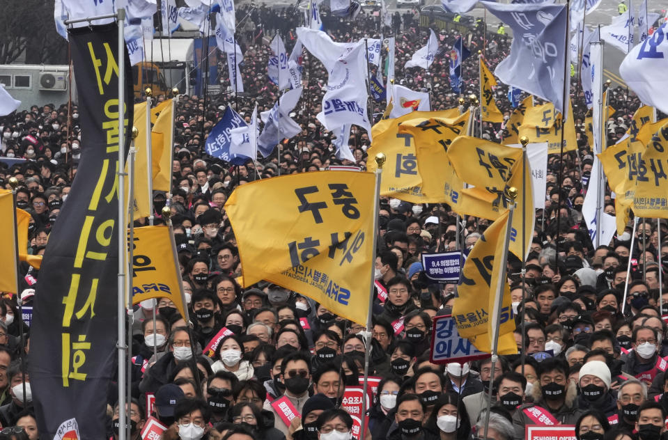 FILE - Doctors stage a rally against the government's medical policy in Seoul, South Korea, on March 3, 2024. South Korean police said Friday, April 26, they searched the office of the hard-line incoming leader of an association of doctors and confiscated his mobile phone as he faces accusations that he incited the protracted walkouts by thousands of medical interns and residents. (AP Photo/Ahn Young-joon, File)