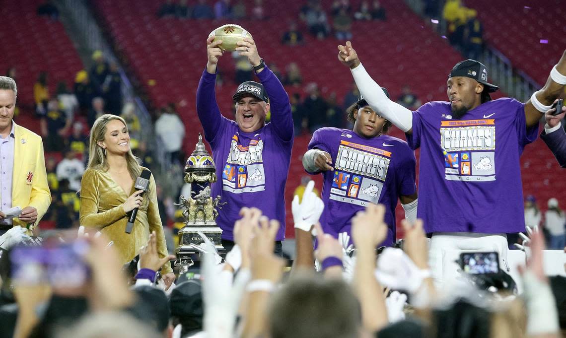 TCU head coach Sonny Dykes holds up the Fiesta Bowl trophy after defeating Michigan at the Vrbo Fiesta Bowl at State Farm Stadium in Glendale, Ariz., on Saturday, December 31, 2022.