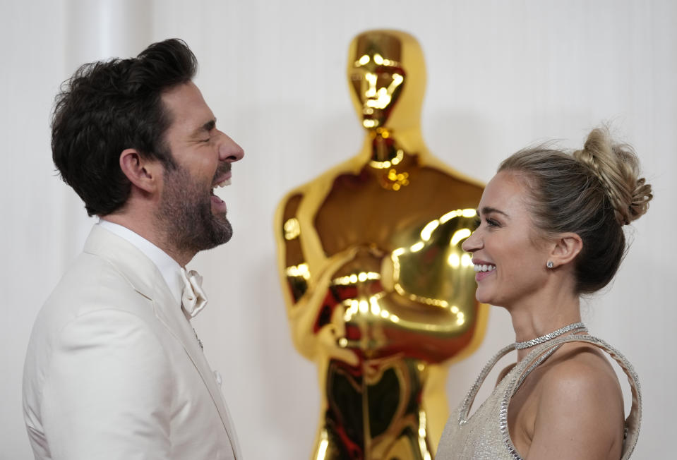 John Krasinski, left, and Emily Blunt arrive at the Oscars on Sunday, March 10, 2024, at the Dolby Theatre in Los Angeles. (AP Photo/Ashley Landis)