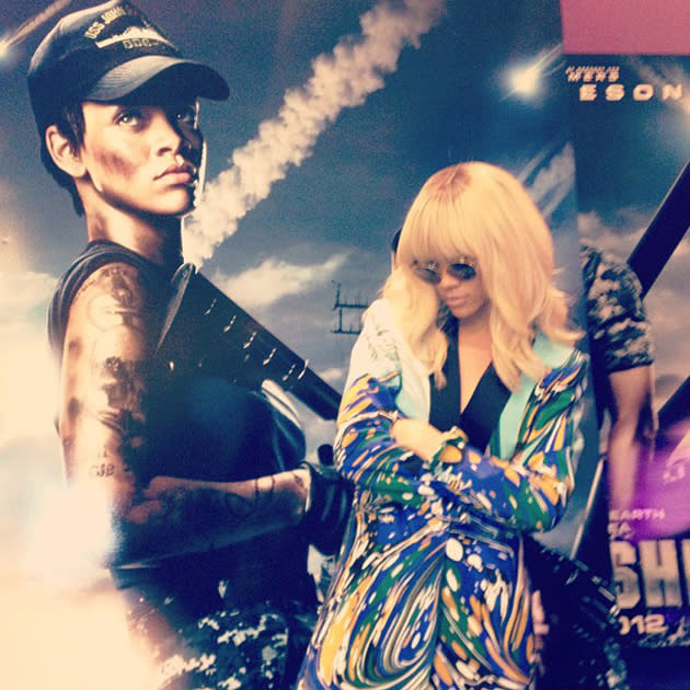 Celebrity photos: Rihanna posed next to this poster of herself in the new movie Battleship. Two Rihannas in one photo? We like this a lot. Girl crush alert!