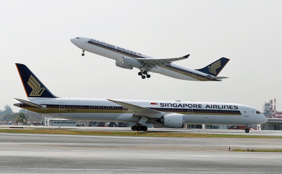 A Singapore Airlines Airbus A330-300 plane takes off behind a Boeing 787-10 Dreamliner at Changi Airport in Singapore on 28 March, 2018. (Reuters file photo)