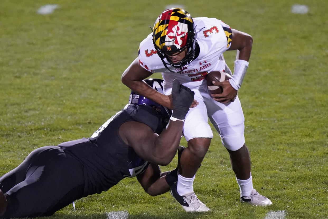 Maryland quarterback Taulia Tagovailoa is sacked by Northwestern defensive line Adetomiwa Adebawore during the second half of an NCAA college football game in Evanston, Ill., Saturday, Oct. 24, 2020. (AP Photo/Nam Y. Huh)