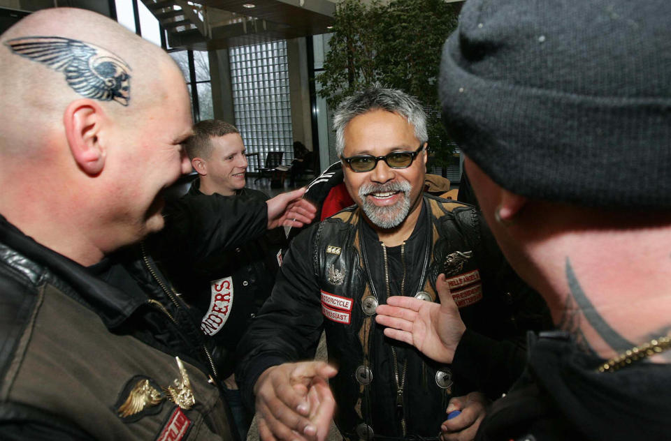 Amsterdam Hells Angels' president Daniel Uneputty  (R) is congratulated by members at the court house of Amsterdam 20 December 2007 after the court dismissed the claim of the public prosecutor to sentence the Hells Angels as a criminal organisation. (EVERT ELZINGA/AFP/Getty Images)