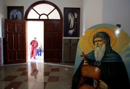 A Christian woman who left with her family from Al-Arish city North Sinai’s Governorate capital after the escalation of a campaign targeting Christians by Islamic State militants last week, walks inside the Saint Church in Ismailia, northeast of Cairo, Egypt February 27, 2017. Picture taken February 27, 2017. REUTERS/Amr Abdallah Dalsh