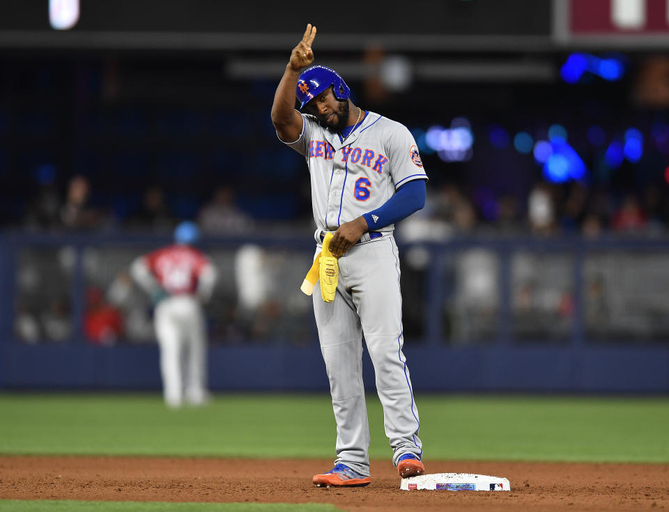 New York Mets' Starling Marte (6) reacts after hitting an RBI double during the ninth inning of a baseball game against the Miami Marlins, Saturday, April 1, 2023, in Miami. Mets' Pete Alonso scored on the play. (AP Photo/Michael Laughlin)