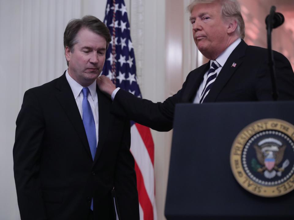 US Supreme Court Justice Brett Kavanaugh is greeted by President Donald Trump at the justice’s ceremonial swearing-in, 8 October, 2018Getty Images