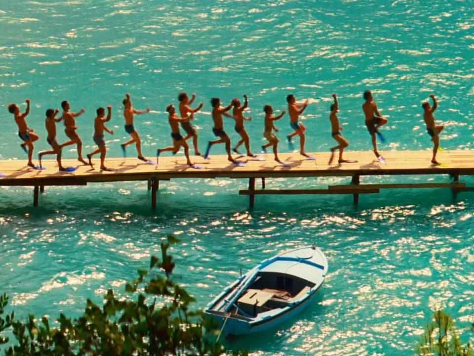 men running down jetty in mamma mia movie