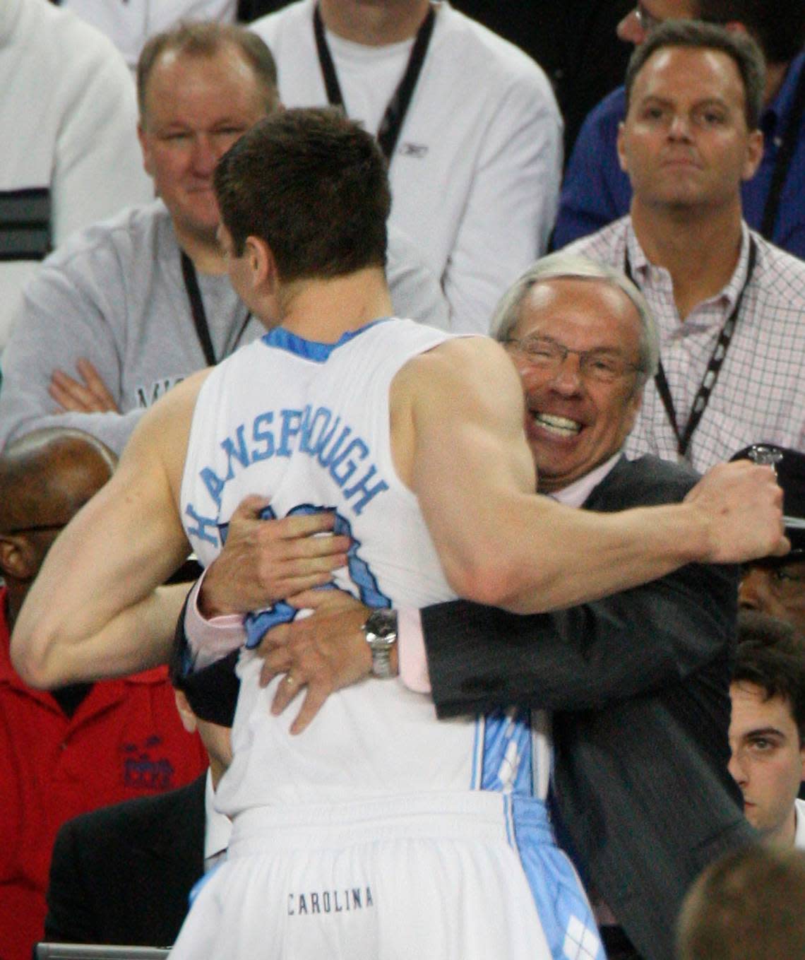 Tyler Hansbrough gets a hug from head coach Roy Williams as he leaves the game against Michigan State at Ford Field in Detroit, Michigan Monday April 6, 2009.