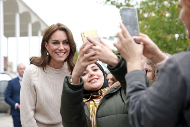 <p>Cameron Smith/Getty</p> Princess Kate poses for a selfie in Nottingham on Wednesday