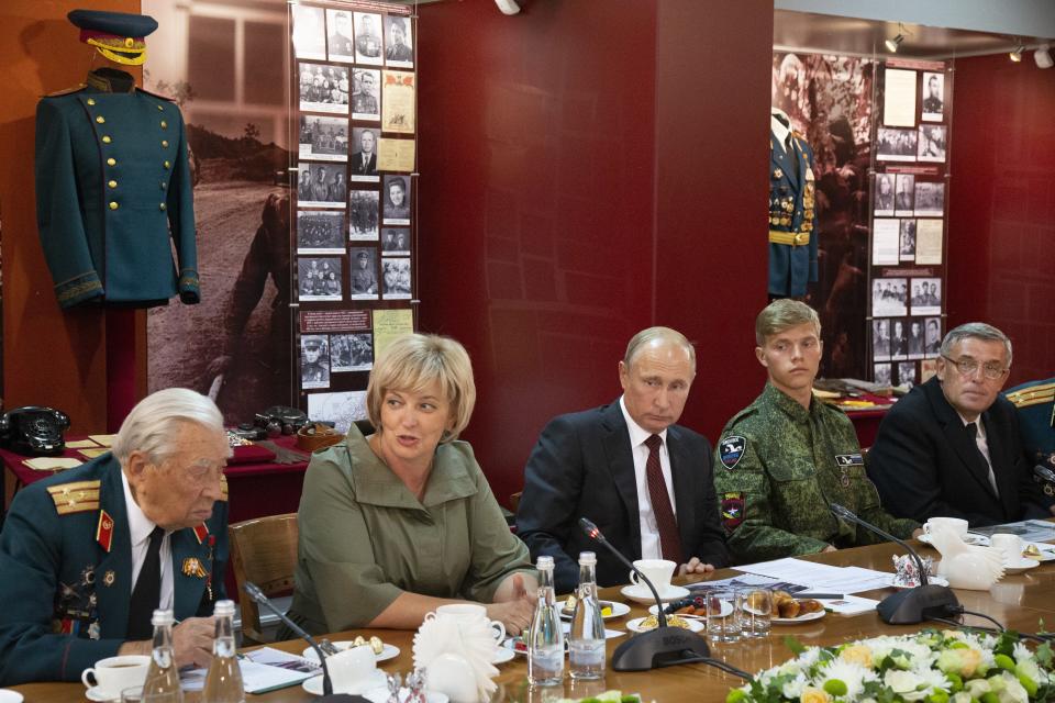 Russian President Vladimir Putin, center, attends a meeting with WWII veterans activists the Kursk Battle memorial museum in Kursk, 426 kilometers (266 miles) south of Moscow, Russia, Thursday, Aug. 23, 2018. Putin attends a ceremony marking the 75th anniversary of the battle of Kursk in which the Soviet army routed Nazi troops. It is described by historians as the largest tank battle in history involving thousands of tanks. (AP Photo/Alexander Zemlianichenko, Pool)