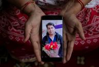 The Wider Image: Indians share the stories of loved ones they lost to the pandemic