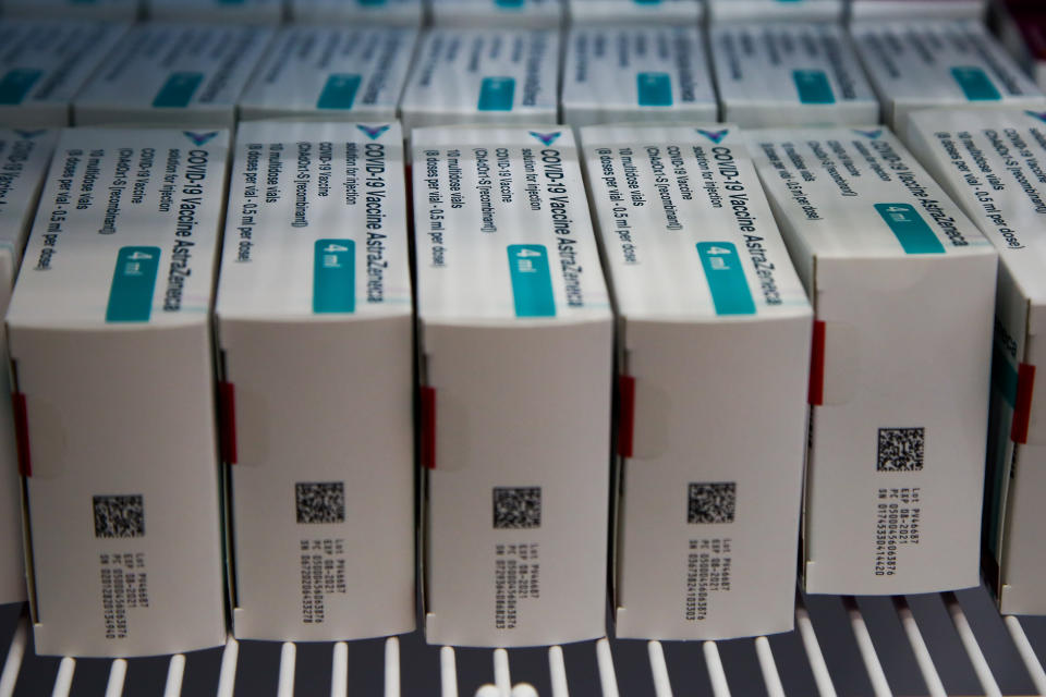 Boxes containing vials of Oxford/AstraZeneca COVID-19 vaccine