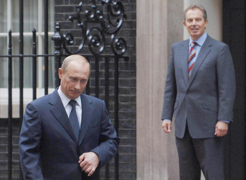 British Prime minister Tony Blair watches as the Russian President Vladimir Putin leaves Downing Street after their meeting today Wednesday 5th October 2005. See PA Story DEFENCE Putin. Press Association Photo. Photo credit should read Stephan Rousseau/PA