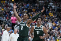 Michigan State guard Tyson Walker (2) and guard A.J. Hoggard (11) celebrate defeating Marquette in a second-round college basketball game in the men's NCAA Tournament in Columbus, Ohio, Sunday, March 19, 2023. (AP Photo/Michael Conroy)