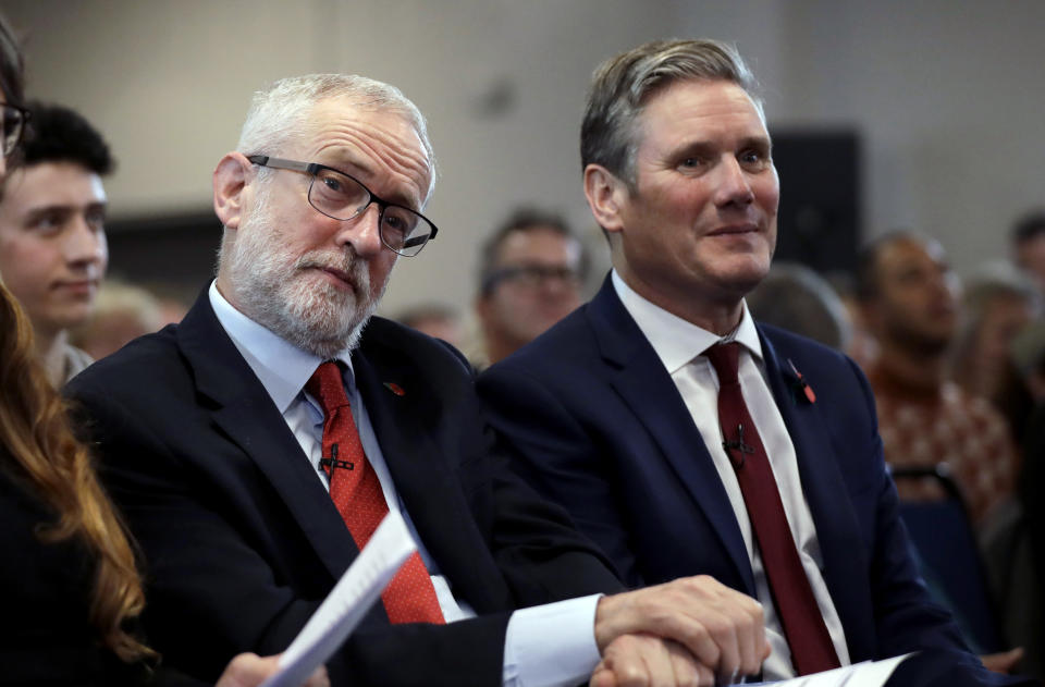 FILE - Britain's opposition Labour party leader Jeremy Corbyn, left, sits waiting to speak next to Keir Starmer Labour's Shadow Secretary of State for Exiting the European Union during their election campaign event on Brexit in Harlow, England, Tuesday, Nov. 5, 2019. Britain goes to the polls on Dec. 12. (AP Photo/Matt Dunham, File)