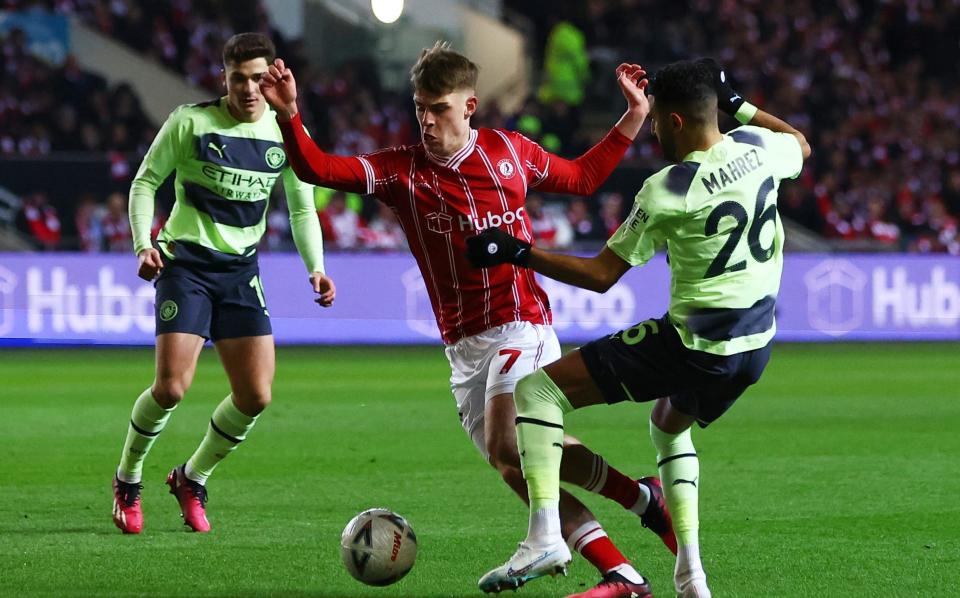 Alex Scott takes on Riyad Mahrez while playing for Bristol City