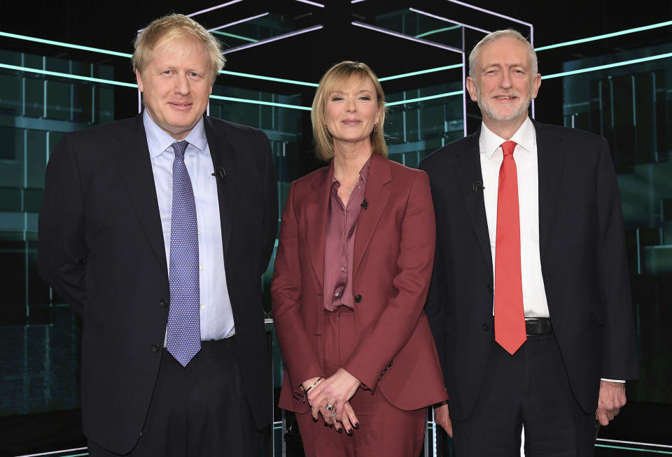 In this photo issued by ITV, showing Boris Johnson, left, and Jeremy Corbyn, right, with TV debate adjudicator Julie Etchingham, prior to their election head-to-head debate live on TV, in Manchester, England, Tuesday, Nov. 19, 2019. Prime Minister Boris Johnson and Jeremy Corbyn are set to go head-to-head in their first live televised debate Tuesday evening, as the UK prepares for a General Election on Dec. 12. (ITV via AP)