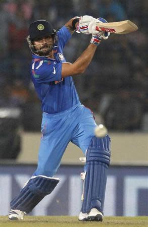 Virat Kohli plays a ball against Sri Lanka during their ICC Twenty20 World Cup cricket final match at the Sher-E-Bangla National Cricket Stadium in Dhaka April 6, 2014. REUTERS/Andrew Biraj