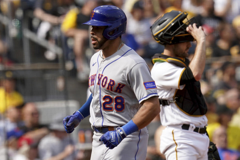 New York Mets' Tommy Pham scores against the Pittsburgh Pirates on a single by Brandon Nimmo in the third inning in a baseball game in Pittsburgh, Saturday, June 10, 2023. (AP Photo/Matt Freed)