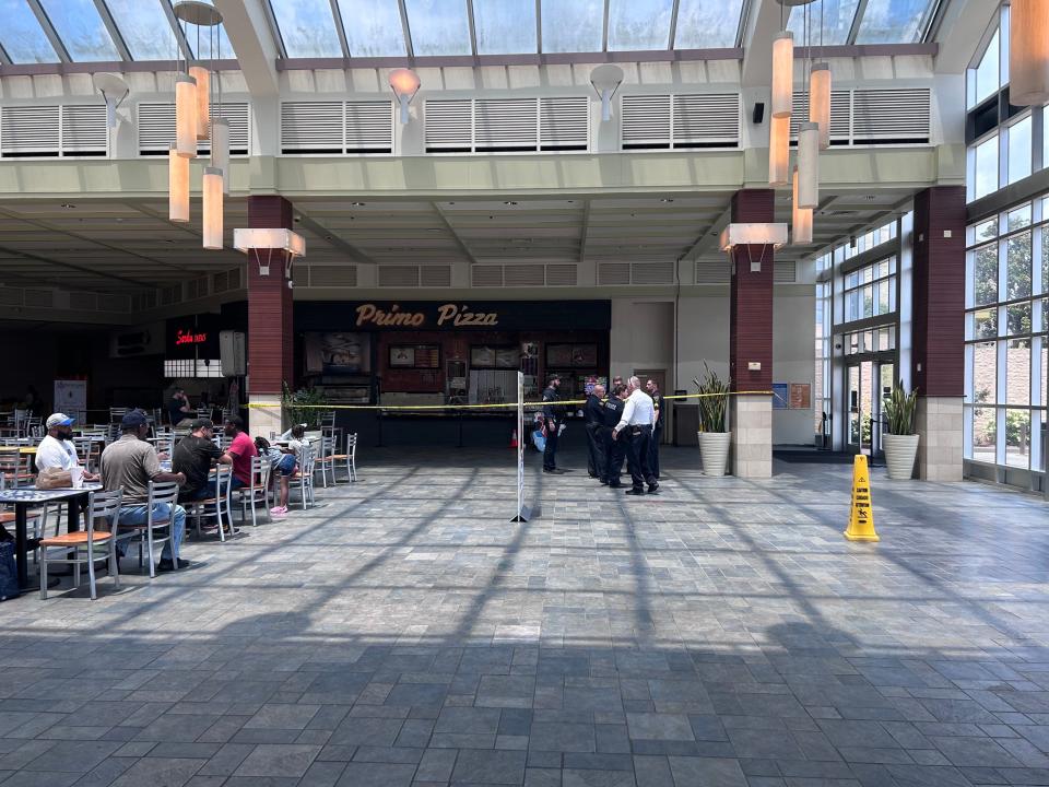 Crime scene tape surrounds the Primo Pizza stand inside the Cross Creek Mall food court on Wednesday, July 26, 2023, after someone fired shots inside the mall. No one was injured.