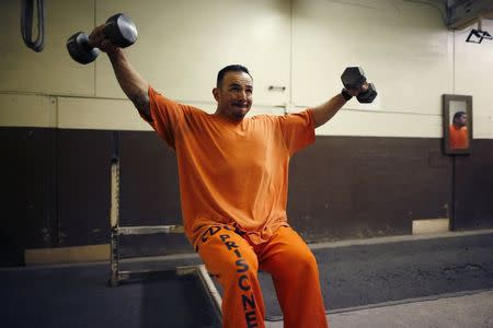 A prison inmate works out at Oak Glen Conservation Fire Camp #35 in Yucaipa, California November 6, 2014. REUTERS/Lucy Nicholson
