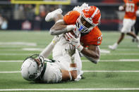 Oklahoma State running back Dezmon Jackson (27) is tackled by Baylor linebacker Dillon Doyle (5) at the goal line in the second half of an NCAA college football game for the Big 12 Conference championship in Arlington, Texas, Saturday, Dec. 4, 2021. (AP Photo/Tim Heitman)