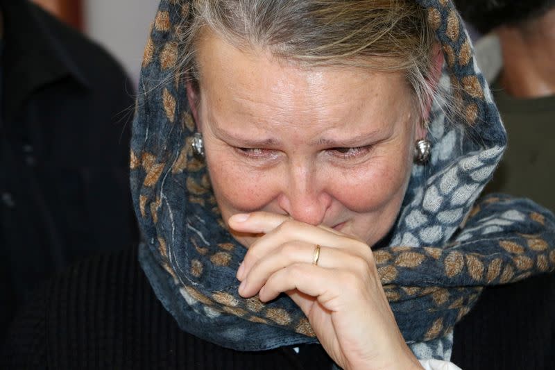 FILE PHOTO: UN Humanitarian Coordinator in Yemen, Grande, reacts as she visits children injured in last week's air strike in Saada