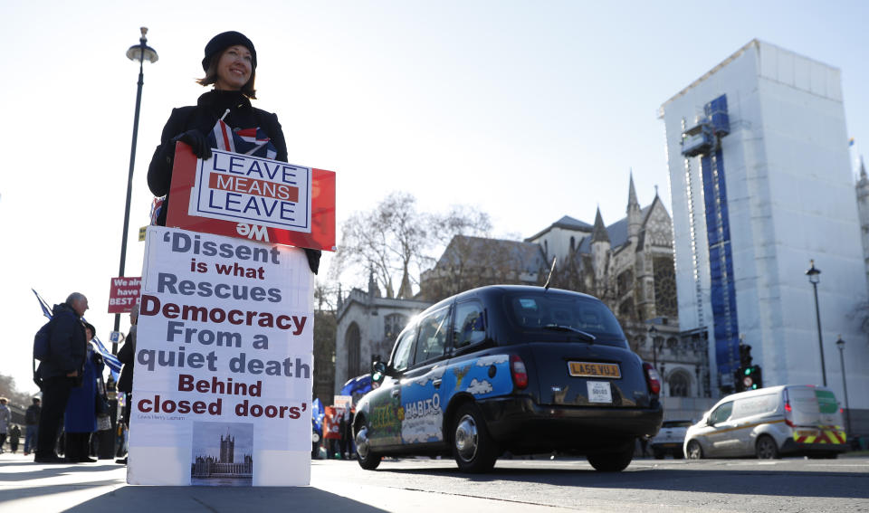 A pro Brexit protester demonstrates outside the Houses of Parliament in London, Monday, Jan. 28, 2019. British Prime Minister Theresa May faces another bruising week in Parliament as lawmakers plan to challenge her minority Conservative government for control of Brexit policy. (AP Photo/Alastair Grant)