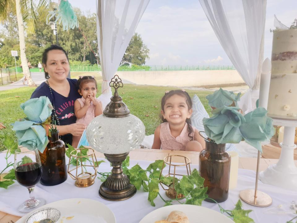 Girls with their nanny posing for photo