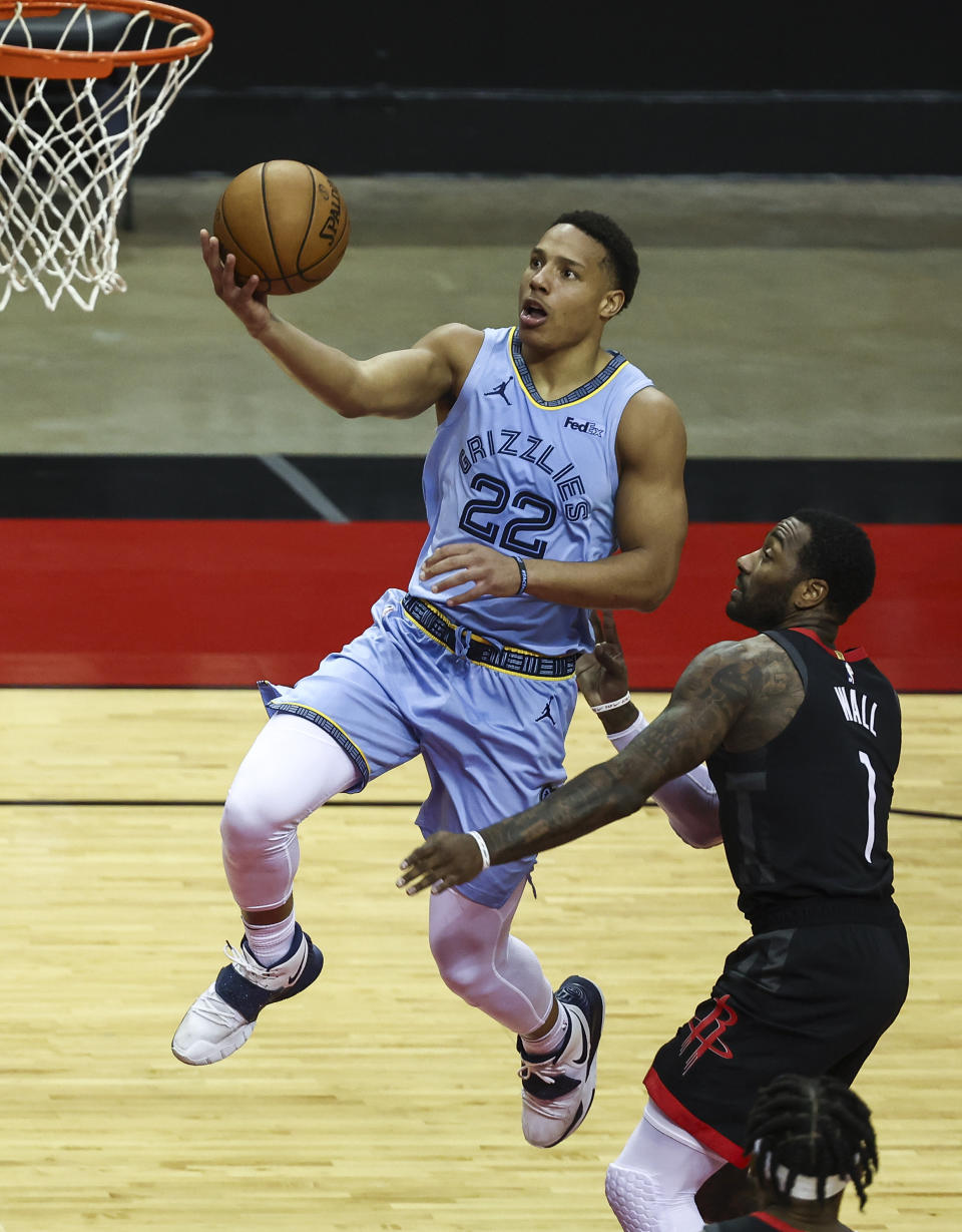 Memphis Grizzlies guard Desmond Bane (22) shoots as Houston Rockets guard John Wall (1) defends during the third quarter of an NBA basketball game Sunday, Feb. 28, 2021, in Houston. (Troy Taormina/Pool Photo via AP)