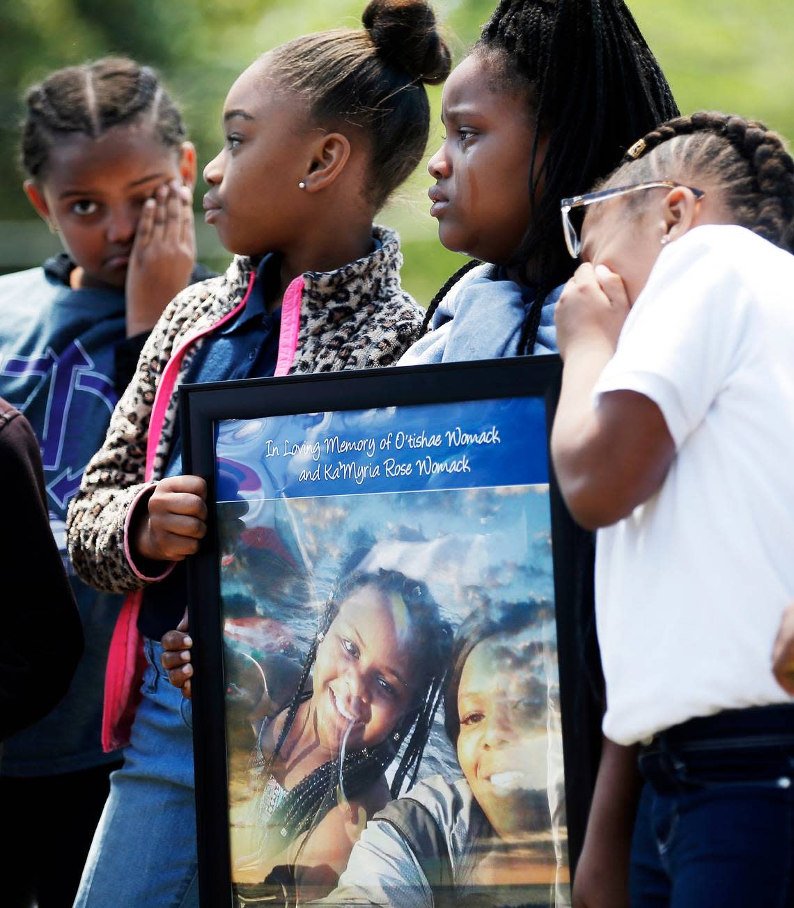 (Starting second from left) Fourth-graders Marlya Dents, 10, Jade Fox, 9, and Ramya Sayles, 9, mourn their friend and classmate Ka’Myria Rose Womack and her mother, O’Tishae Womack, both apparent victims of domestic violence, during a memorial on April 20, 2018, at Morningside Elementary School in Fort Worth, where Ka’Myria was a student.