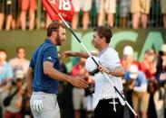 Jun 19, 2016; Oakmont, PA, USA; Dustin Johnson (left) celebrates with his caddie Austin Johnson after winning the U.S. Open golf tournament at Oakmont Country Club. Mandatory Credit: John David Mercer-USA TODAY Sports