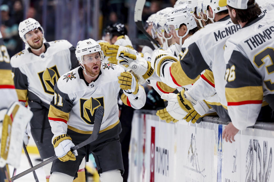 Vegas Golden Knights right wing Jonathan Marchessault is congratulated for his goal against the Seattle Kraken during the third period of an NHL hockey game Tuesday, March 12, 2024, in Seattle. (AP Photo/Maddy Grassy)