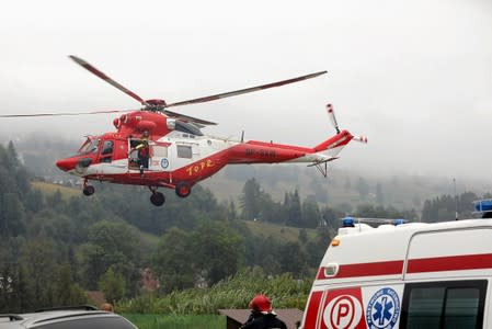 TOPR (Tatra Volunteer Search and Rescue) helicopter takes part in a rescue operation after a thunderstorm in the Tatra Mountains, in Zakopane