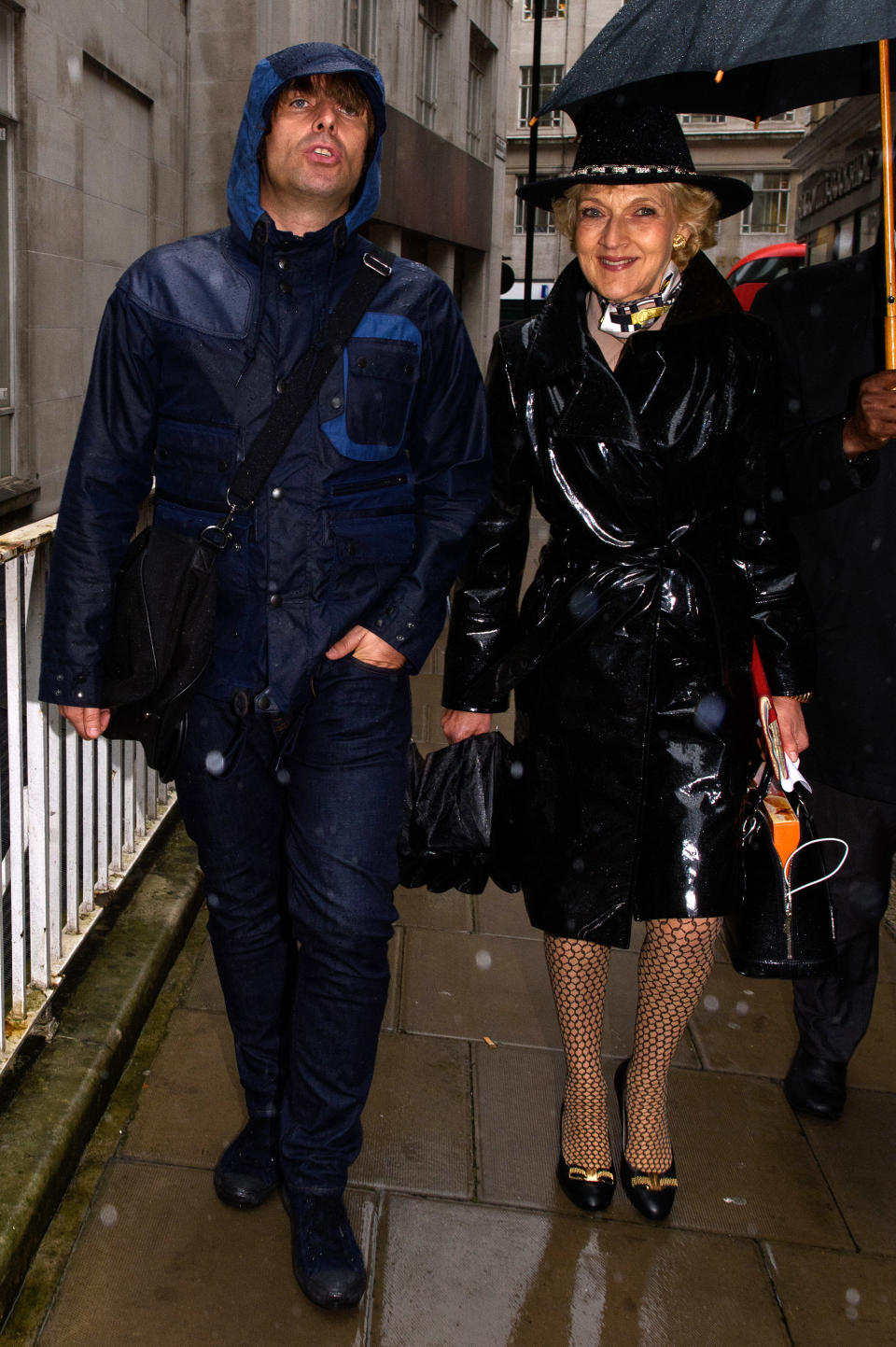 LONDON, ENGLAND - SEPTEMBER 16:  (L-R) Liam Gallagher and Fiona Shackleton arrive at The Family Court on September 16, 2015 in London, England. The former Oasis front man met Nicole Appleton, also a singer with the girl group All Saints, in  2000 and went on to have a son Gene.  They split in 2013 after he fathered a child with American journalist Liza Ghorbani. The hearing takes place in private.  (Photo by Ben Pruchnie/Getty Images)