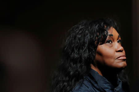 Tamara Lanier listens as her lawyer speaks to the media about a lawsuit accusing Harvard University of the monetization of photographic images of her great-great-great grandfather, an enslaved African man named Renty, and his daughter Delia, outside of the Harvard Club in New York, U.S., March 20, 2019. REUTERS/Lucas Jackson