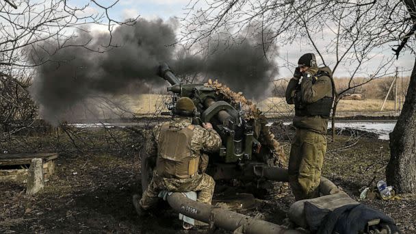PHOTO: FILE - Ukrainian servicemen fire a 105mm Howitzer towards Russian positions, near the city of Bakhmut, March 4, 2023. (Aris Messinis/AFP via Getty Images, FILE)