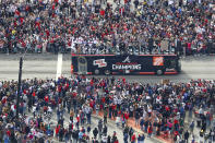 Fans cheer the 2021 World Series baseball champion Atlanta Braves during a victory parade in Atlanta, Friday, Nov. 5, 2021. (Curtis Compton/Atlanta Journal-Constitution via AP)