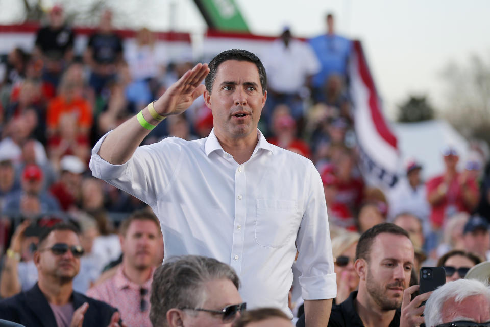 FILE - Ohio Secretary of State Frank LaRose is acknowledged by former President Donald Trump at a rally at the Delaware County Fairgrounds, Saturday, April 23, 2022, in Delaware, Ohio, to endorse Republican candidates ahead of the Ohio primary on May 3. Add one more contest to the white-hot races for Congress and governor that will dominate this year's midterm elections: secretaries of state. Former President Donald Trump's attempts to reverse the results of the 2020 election and his subsequent endorsements of candidates for state election offices who are sympathetic to his view have elevated those races to top-tier status.(AP Photo/Joe Maiorana, File)