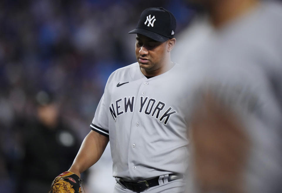 New York Yankees relief pitcher Wandy Peralta walks off the field after giving up a game-ending, three-run home run to Toronto Blue Jays' Danny Jansen during the 10th inning of a baseball game Wednesday, May 17, 2023, in Toronto. (Frank Gunn/The Canadian Press via AP)