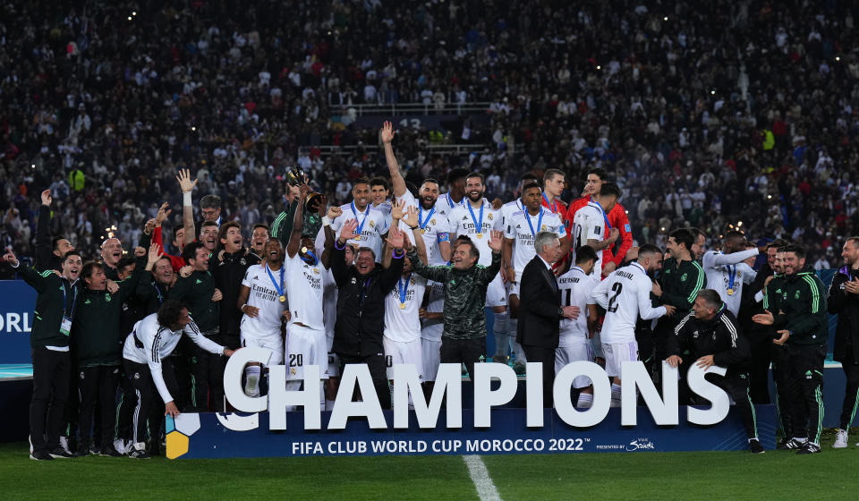 RABAT, MOROCCO - FEBRUARY 11: Vinicius Junior of Real Madrid lifts the FIFA Club World Cup Morocco 2022 Trophy following their sides victory in the FIFA Club World Cup Morocco 2022 Final match between Real Madrid and Al Hilal at Prince Moulay Abdellah on February 11, 2023 in Rabat, Morocco. (Photo by Angel Martinez - FIFA/FIFA via Getty Images)