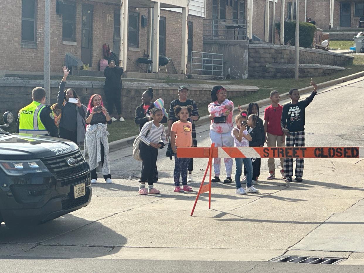 A small crowd gathered to wave and cheer as President Biden's motorcade arrived at the Pieper-Hillside Boys & Girls Club at 611 W. Cherry St. in Milwaukee on Wednesday, March 13, 2024.
